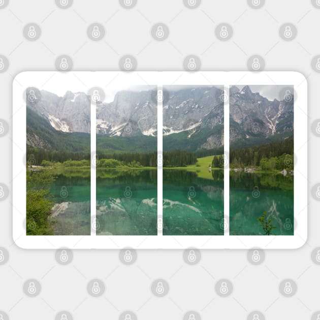 A static shot from the shore of Fusine lake in the Julian Alps with snowy mountains in background. Beautiful nature in a spring cloudy day; no people around Sticker by fabbroni-art